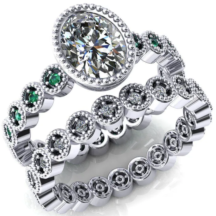 Borea Oval Center Stone Full Bezel Milgrain Emerald Accent Full Eternity Ring Fire Brilliance Rings Borea Oval Center Stone Full Bezel Milgrain Emerald Accent Full Eternity Ring Fire Brilliance Rings