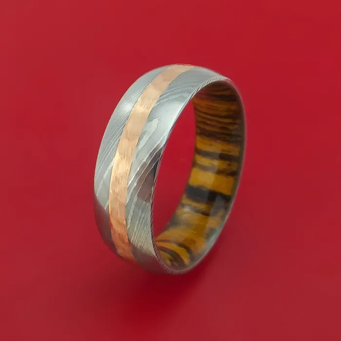 Lashbrook Damascus Steel Ring with 14k Rose Gold Inlay and Interior Hardwood Sleeve Custom Made Band Rings Lashbrook Damascus Steel Ring with 14k Rose Gold Inlay and Interior Hardwood Sleeve Custom Made Band Rings